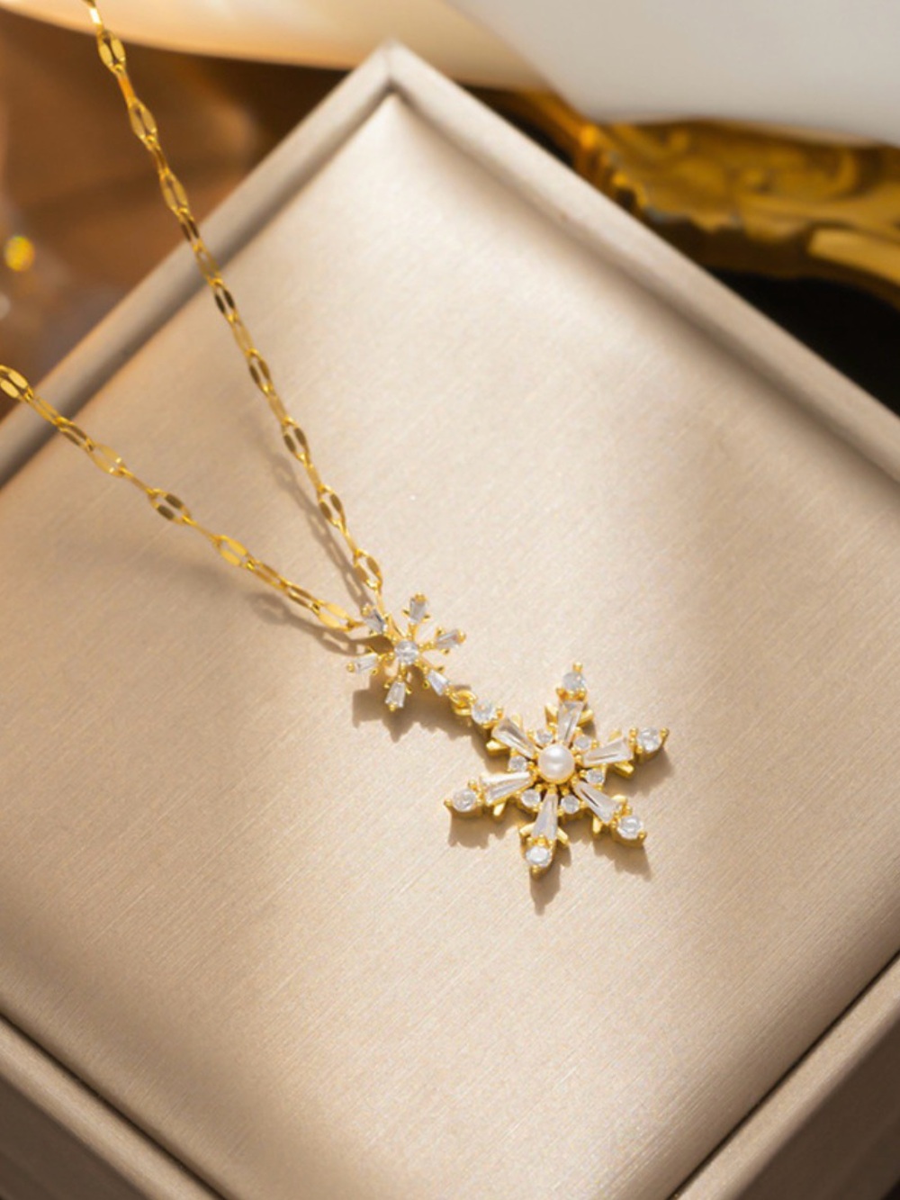 Gold Snowflake Pendant Necklace with Pearl Accent
